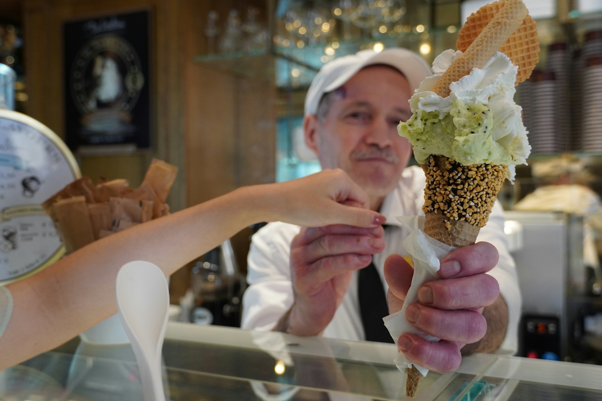 A man and a woman holding an ice cream cone